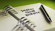 © xtock - Closeup of a personal agenda setting an important date writing w
