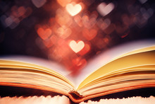 Open Book Against Heart Shaped Bokeh, Valentines Day Concept