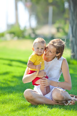 happy mother with her son in nature