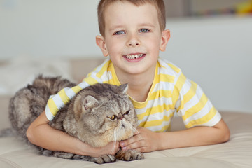 Wall Mural - Happy boy with a cat