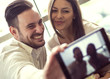 © ivanko80 - Young couple taking a selfie