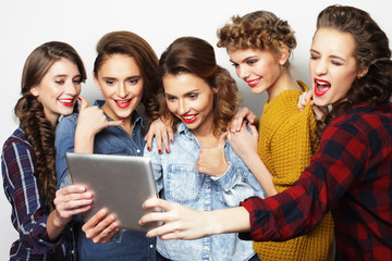  five hipster girls friends taking selfie with digital tablet