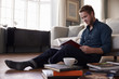 © chickenstockimages - Young man reading books