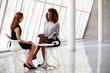 © Monkey Business - Two Businesswomen Meeting In Reception Of Modern Office