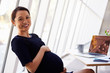 © Monkey Business - Portrait Of Pregnant Businesswoman Using Laptop In Office