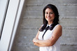 © Monkey Business - Portrait Of Businesswoman Standing Against Wall In Office