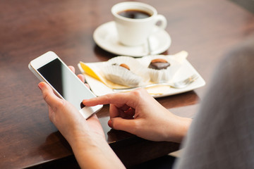 Wall Mural - close up of woman with smartphone and dessert