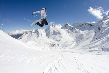 Wall Mural - Flying snowboarder on mountains. Extreme sport.