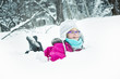 © Louis-Paul Photo - Little Girl Playing with Snow Outdoors in Winter