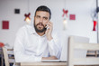 © nikodash - Handsome business man sitting in coffee shop and working on his laptop,shallow depth of field