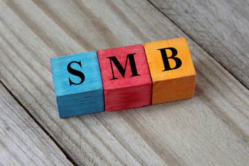 Wall Mural - SMB text (Small Medium-sized Business) on colorful wooden cubes