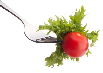 Fresh salad and cherry tomato on fork isolated on white backgrou