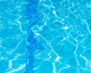 Background of rippled pattern of clean water in a blue.