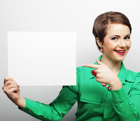 young casual woman happy holding blank sign 