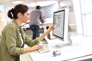 Wall Mural - Industrial designer working on desktop computer