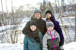 © Louis-Paul Photo - Happy parents and their kids in winterwear