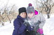 © Louis-Paul Photo - Portrait of mother and her daughter blowing on snow in their hands