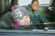 © Louis-Paul Photo - caucasian girl in warm clothes traveling in a car seat