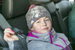 © Louis-Paul Photo - caucasian girl in warm clothes traveling in a car seat