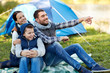 © Syda Productions - happy family with tent at camp site