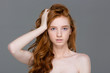 Beauty portrait of tender woman with beautiful long red hair