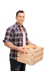 Poster - Young guy holding an empty wooden crate