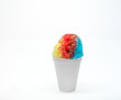 Hawaiian Rainbow shaved ice, shave ice, or snow cone in a white cup with a white background.