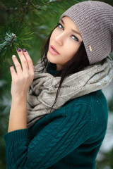 Wall Mural - Beautiful young woman in wintertime outdoor