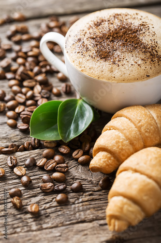 Naklejka na meble Hot coffee and pastries on a wooden background