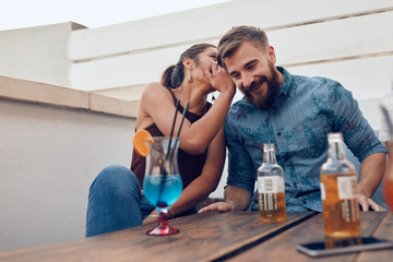 Wall Mural - Couple gossiping during party