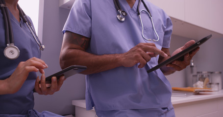 Doctors using devices in the office