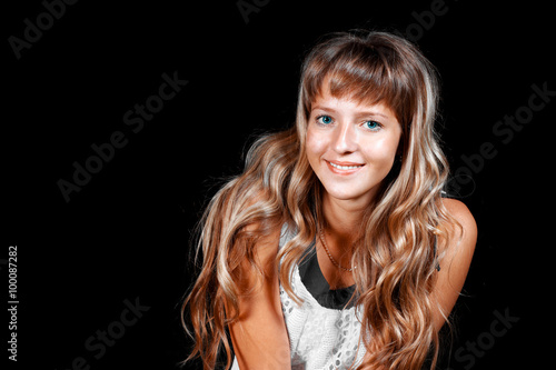Smiling Beautiful Blue Eyed Blonde Girl In White Dress On A Black