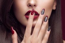Pretty Girl With Unusual Hairstyle, Bright Makeup, Red Lips And Manicure Design. Beauty Face. Art Nails.