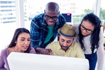 Wall Mural - High angle view of happy business people discussing at desk