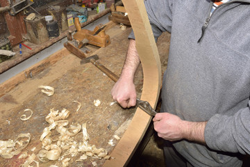 Wall Mural - carpenter working with plane on wooden