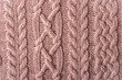 Pink figured sweater background horizontal
