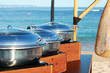 Stainless dishes for buffet on the beach