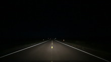 Country Road Driving at Night in Middle Lane. perspective of a vehicle driving at night over the middle lane on country roads using high beam headlights. Swerving back in and out of lane
