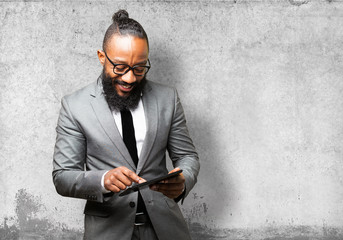 Wall Mural - business black man with a tablet