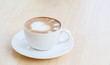 © amnarj2006 - heart symbol on latte coffee cup on table