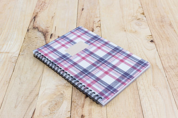 Wall Mural - Fabric plaid texture cover spiral notebook.