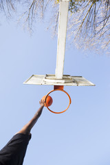 Wall Mural - Basketball player jumping to dunk