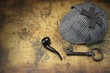 Deerstalker Sherlock Hat, Vintage Key, Smoking Pipe On Old Map.