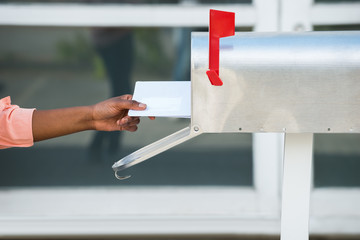 Wall Mural - Person Putting Letters In Mailbox