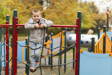 Wall Mural - Little boy at playground