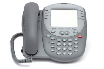 Modern office system phone with large LCD screen. Isolated on wh