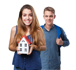 Wall Mural - happy woman showing a house on white