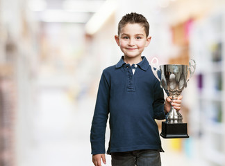 Wall Mural - little kid with a trophy