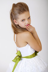 Wall Mural - Portrait of a little girl in white classic dress