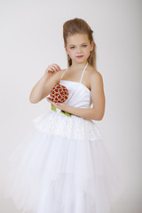 Wall Mural - Portrait of a little girl in white classic dress